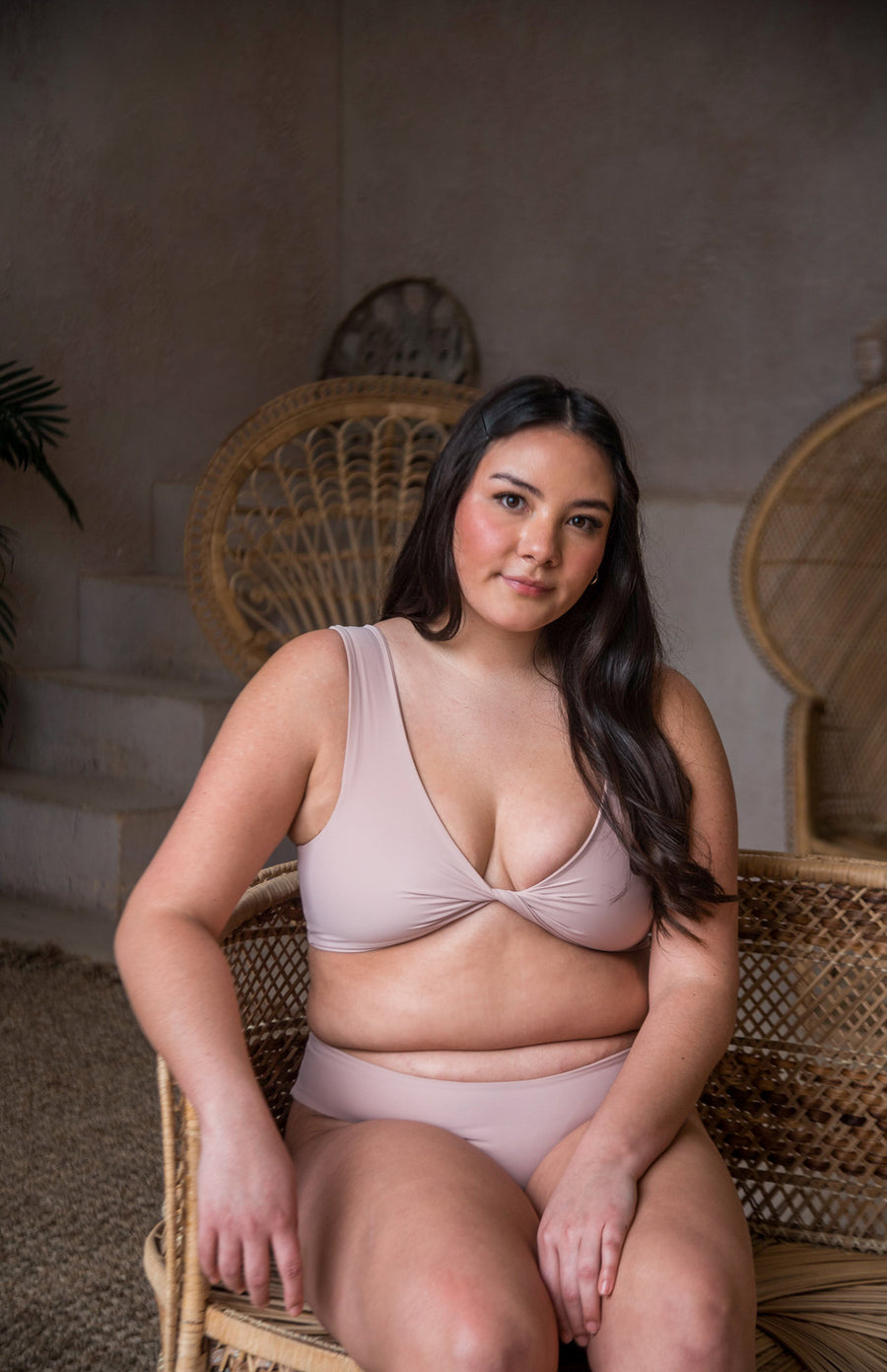 2 in 1 bikini top. One side is scoop neck and the other is a twisted v neck in blush bikini top.